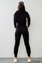 Luméri Leisure | Womens Tracksuit Set With An Asymmetric Sweatshirt Black Fi718 worn on model – LUMÉRI