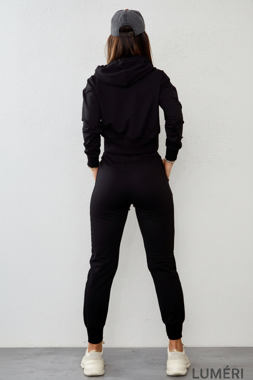 Luméri Leisure | Womens Tracksuit Set With An Asymmetric Sweatshirt Black Fi718 worn on model – LUMÉRI