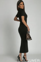 Luméri Muse | Turtleneck Midi Pencil Dress Black 2 worn on model – LUMÉRI