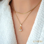 Luméri Aura | 24 Karats Cubic Zirconia Tear Drop Cage Necklace worn on model – LUMÉRI