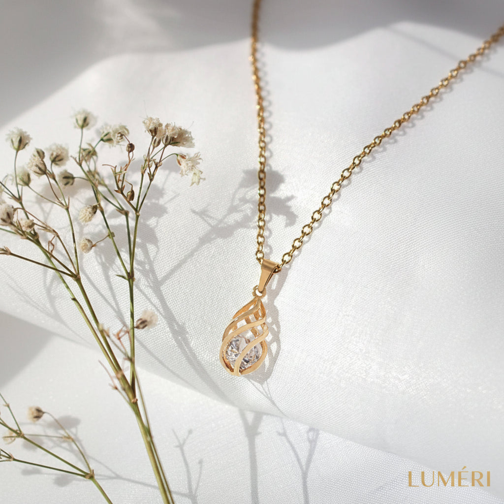 Luméri Aura | 24 Karats Cubic Zirconia Tear Drop Cage Necklace close-up detail – LUMÉRI