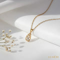Luméri Aura | 24 Karats Cubic Zirconia Tear Drop Cage Necklace product photo – LUMÉRI