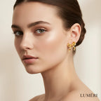 Luméri Essence | Gold Small Bow Drop Earrings For Women Elegant Delicate Jewelry worn on model – LUMÉRI