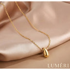 Luméri Solis | Stainless Steel Gold Teardrop Necklace worn on model – LUMÉRI