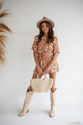 Luméri Studio | Summer Floral Jumpsuit With Collar Orange And Cream 1 photo – LUMÉRI
